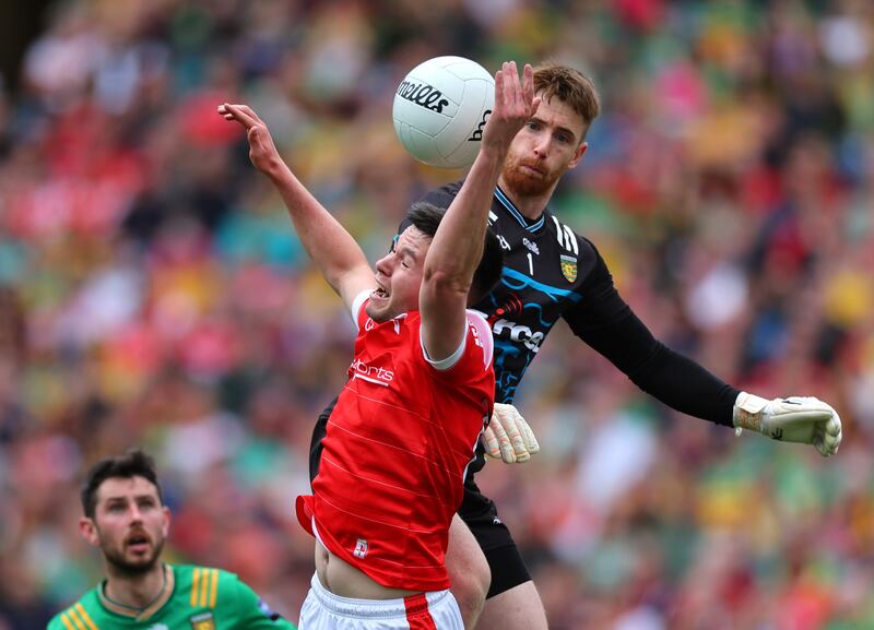 Donegal’s goalkeeper Shaun Patton and Liam Jackson of Louth compete for possession during their game on Sunday. Photograph: James Crombie/Inpho