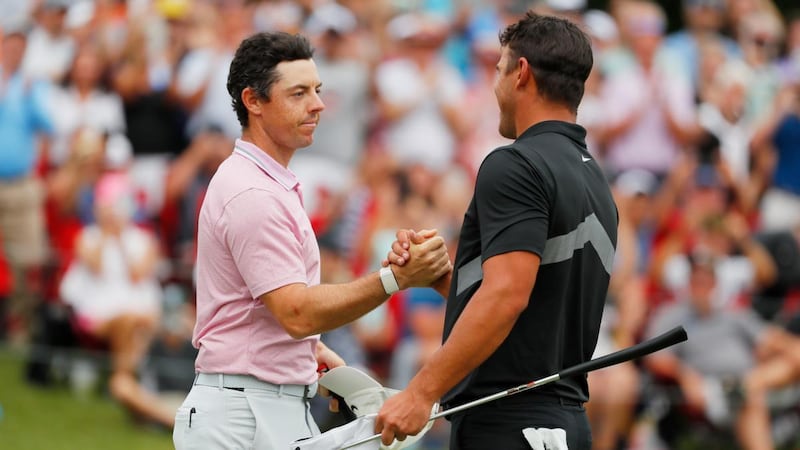 Rory McIlroy is congratulated by Brooks Koepka after winning the FedEx Cup and Tour Championship at East Lake Golf Club on in Atlanta. Photograph: Kevin C Cox/Getty Images