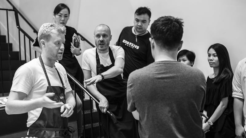 Moriarty and Viljanen brief the team during their previous visit to Hong Kong in 2016