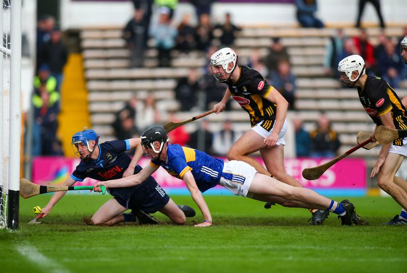 Tipperary’s Daire English and Owen O’Dwyer dive to keep the ball from entering the goal during the MHC final against Kilkenny. Photograph: Ken Sutton/Inpho