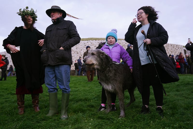 Eadaoin Heavey (right) and her eight-year-old daughter Sadhbh, who both celebrate their birthday today, pictured as people gathered for sunrise at Newgrange. Photograph: Brian Lawless/PA Wire