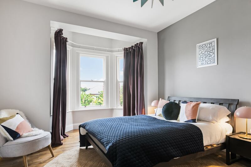 The main bedroom has a bay window