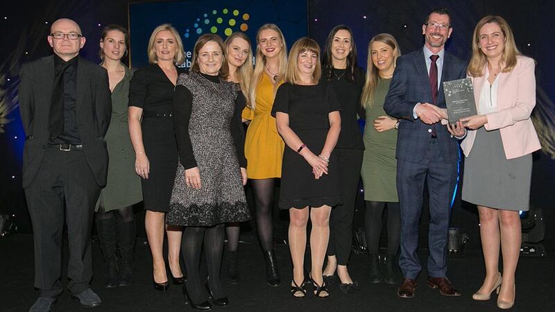 Dr. Fiona Blighe, Scientific Programme Manager, Science Foundation Ireland, presents the Medical Laboratory of the Year to Microbiology Laboratory, Tallaght University Hospital team.