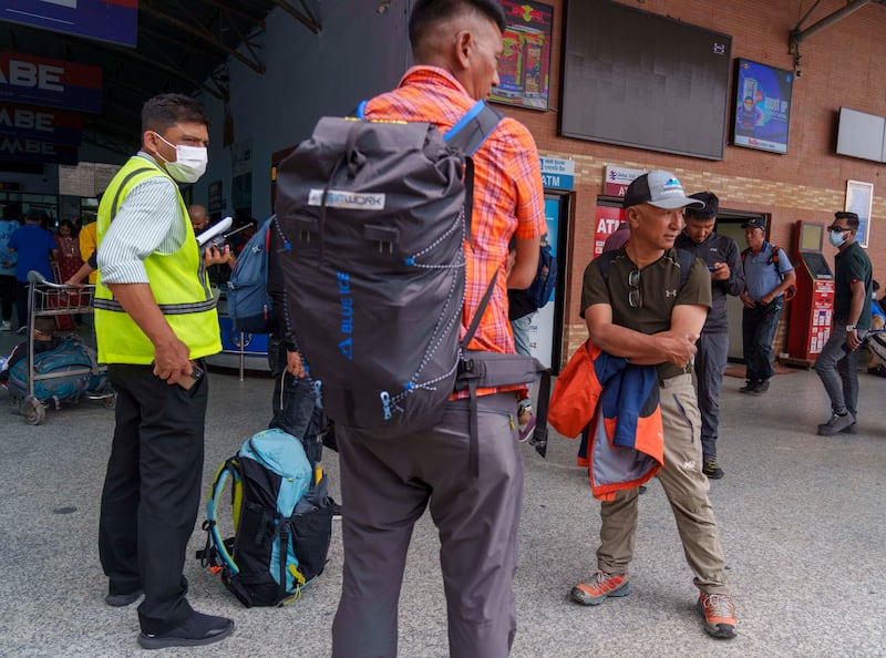 A team of climbers prepare to leave for rescue operations from the Tribhuvan International Airport in Kathmandu, Nepal, on Sunday (Niranjan Shreshta/AP)