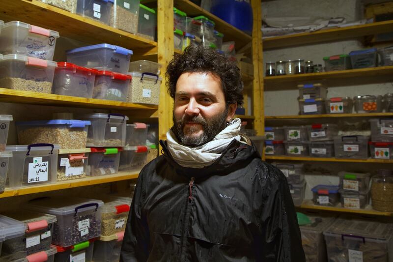 Serge Harfouche in a  storage room lined with boxes containing more than 300 varieties of seeds native to Iraq, Syria and Lebanon. Photograph: Hannah McCarthy