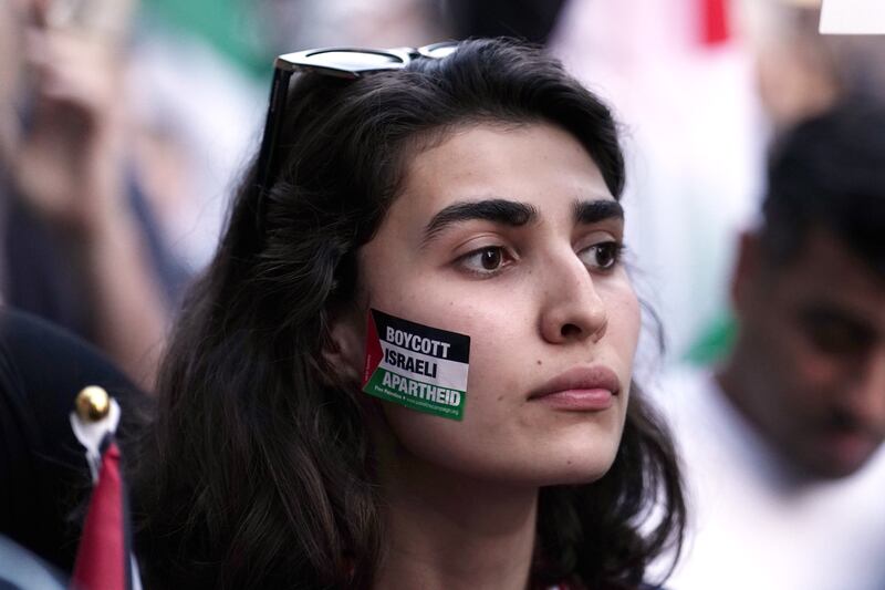 People take part in a Palestine Solidarity Campaign demonstration near the Israeli embassy in London. Photograph: Jordan Pettitt/PA Wire