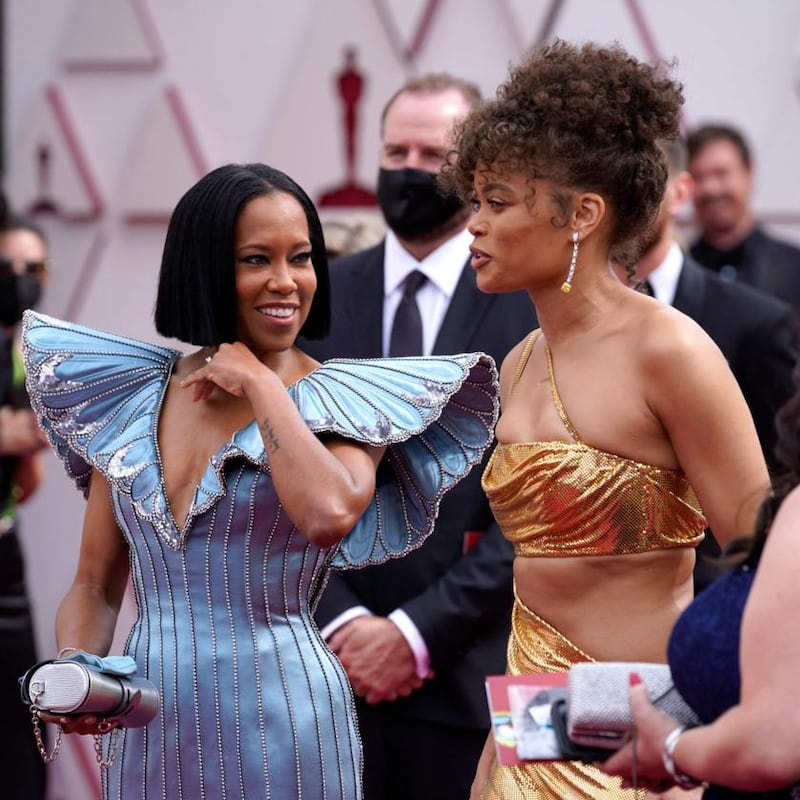 US actress Regina King (L) and US actress and singer Andra Day (R) arrive at the Oscars on April 25, 2021, at Union Station in Los Angeles. (Photo by Chris Pizzello / POOL / AFP) (Photo by CHRIS PIZZELLO/POOL/AFP via Getty Images)