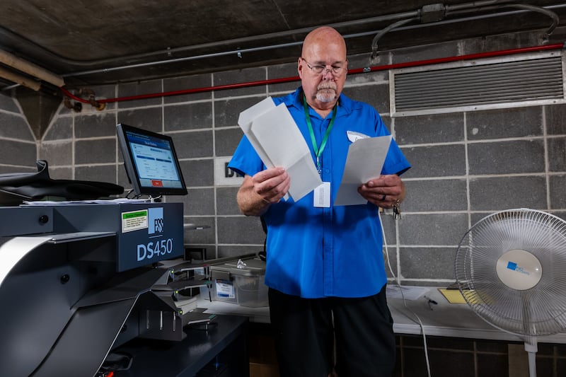 Poll workers process ballots in Janesville, Wisconsin. Photograph: Spencer Platt/Getty Images