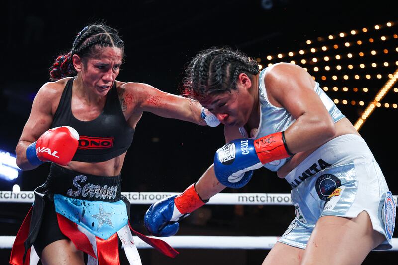 Amanda Serrano catches Erika Cruz with a left hand during the featherweight title fight at the  Hulu Theatre, Madison Square Garden, New York. Photograph: Ed Mulholland/Matchroom Boxing/Inpho
                                                