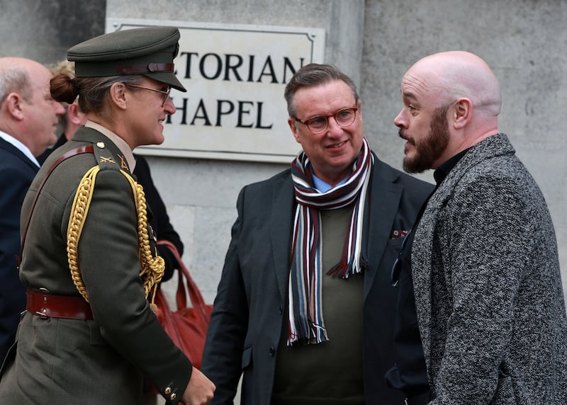 Comdt Deirdre Newell, aide-de-camp to Michael D Higgins, with RTÉ radio presenter Shay Byrne and Pat Ingoldsby's nephew David Gibson. Photograph: Colin Keegan/Collins