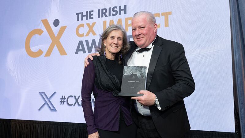 Jan Richards, awards judge, presents the CX impact in retail award to Eddie Kearney, PTSB