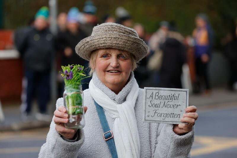 Sheila O’Byrne from Ringsend watching the funeral procession of Shane MacGowan. Photograph: Alan Betson

