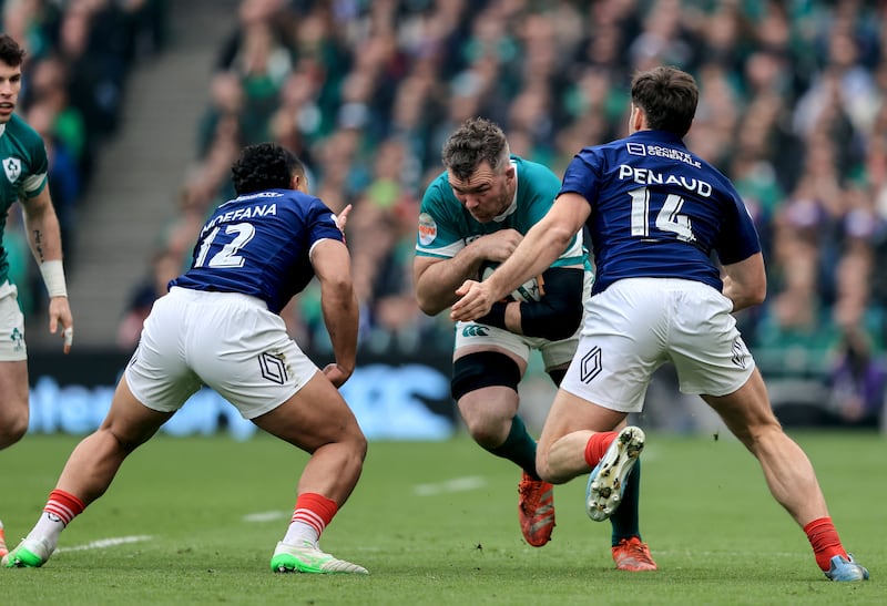 Ireland's Peter O'Mahony comes up against France's Yoram Moefana and France's Damian Penaud. Photograph: Dan Sheridan/Inpho