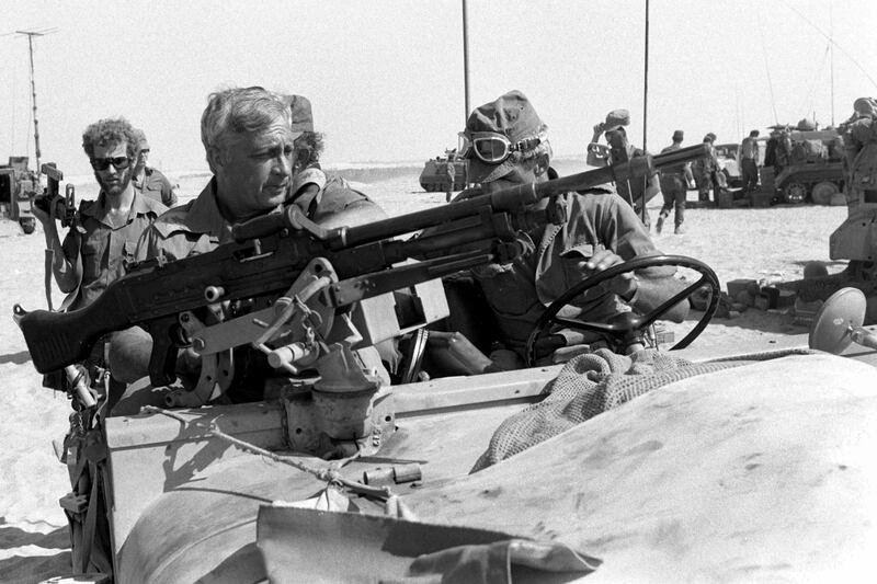  Israeli army general Ariel Sharon, who later became prime minister,  inspects the Egyptian front in the Sinai Desert during the Yom Kippur War  in October 1973. Photograph:  Getty Images