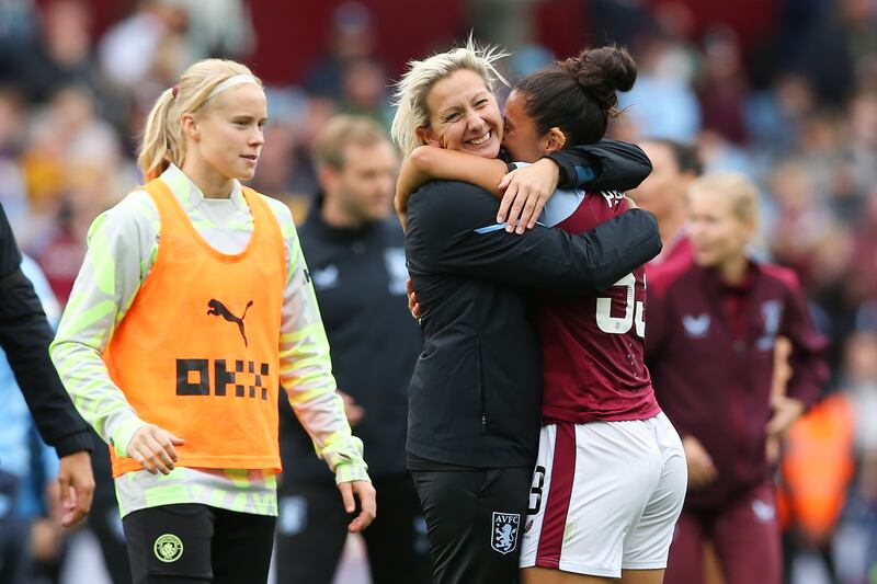 Carla Ward, manager of Aston Villa, embraces Mayumi Pacheco after beating Manchester City. Photograph: Barrington Coombs/Getty