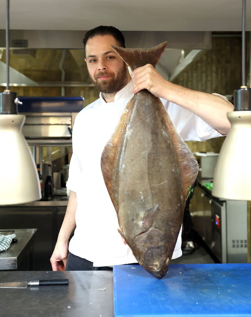 The Bucks Head chef Alex Greene with a freshly caught halibut. Photograph: Stephen Davison