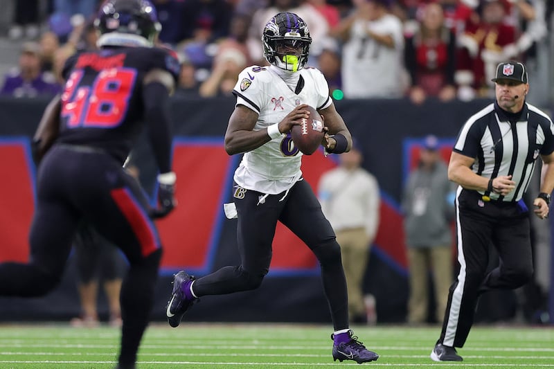 Lamar Jackson of the Baltimore Ravens scrambles during the second quarter against the Houston Texans at NRG Stadium on Christmas Day. Photograph: Alex Slitz/Getty Images