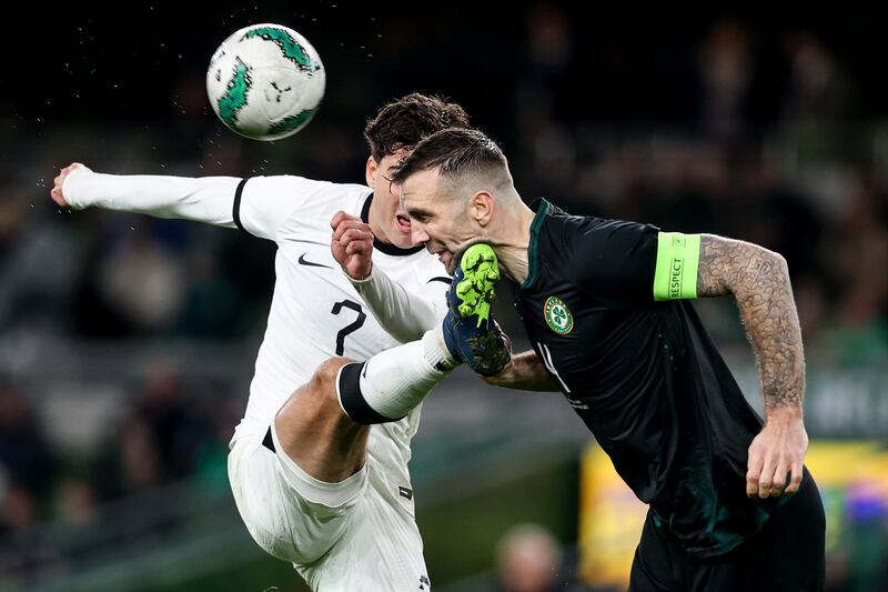 Ireland's Shane Duffy heads clear under pressure from New Zealand's Matt Garbett. Photograph: Ben Brady/Inpho