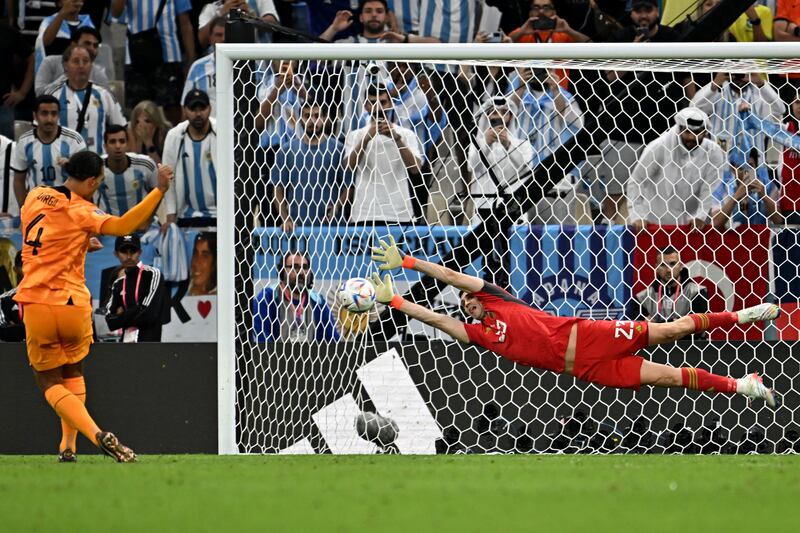 Argentina's goalkeeper Emiliano Martinez saves a penalty by Netherlands' defender Virgil van Dijk during a penalty shoot-out after their World Cup quarter-final match in Qatar. Photograph: Manan Vatsyayana/AFP