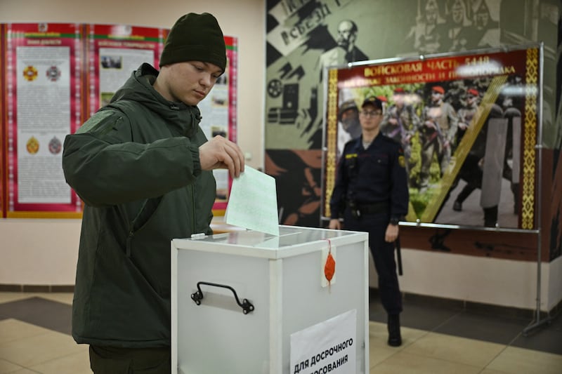 A Belarusian serviceman casts his ballot in Minsk this week during early voting in the country's presidential election. Photograph:  Natalia Kolesnikova/AFP via Getty Images