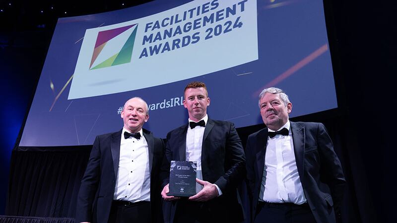 Pat Bennett, operations director of Mitie, presents the FM project of the year – private sector award to Trevor O'Brien and Aaron O'Brien, O'Brien Facilities