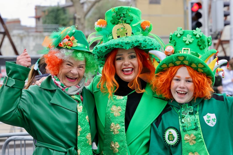 Zdzislawa Szakola, Julita O'Toole and Jakob O'Toole from Carlingford and Poland enjoying the festivities surrounding the parade in Dublin city centre on St Patrick’s Day. Photograph: Alan Betson