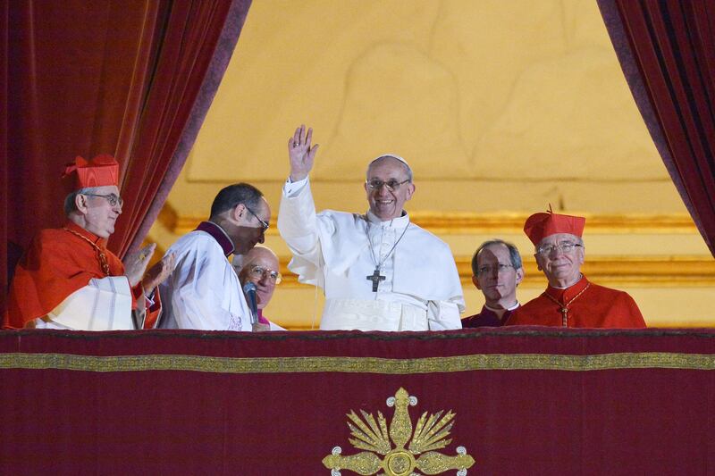 2013. Argentina's Jorge Bergoglio, elected Pope Francis I (C) waves from the window of St Peter's Basilica's balcony after being elected the 266th pope of the Roman Catholic Church on March 13, 2013 at the Vatican.      Photograph: Vincenzo Pinto/AFP via Getty Images