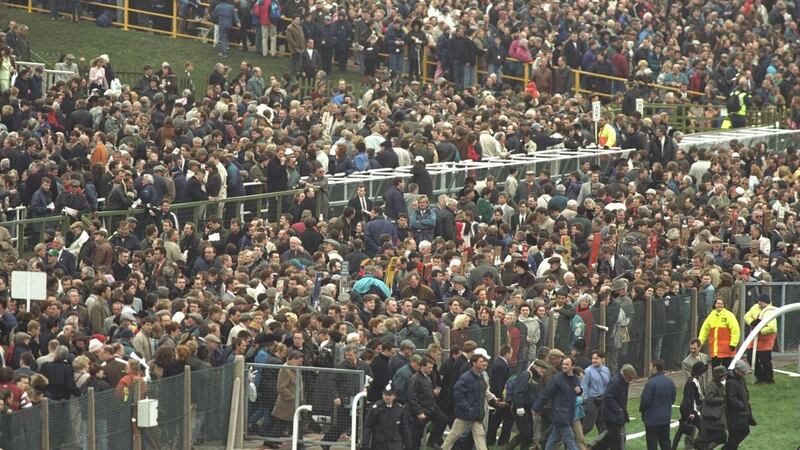 Crowds file on to the Aintree course after the order came of evacuate the stands following a bomb scare ahead of the 1997 Grand National. Photograph: Mike Cooper/Allsport