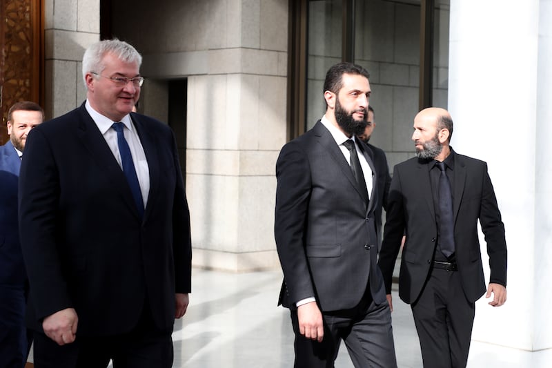 Ahmed al-Sharaa greets Ukrainian foreign minister Andrii Sybiha (left) ahead of a meeting in Damascusin December. Photograph: Ali Haj Suleiman/Getty Images