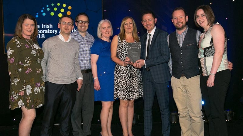 David Bryant, Segment Programme Manager, Speciality and Medical Gases, Air Products presents the Bio Science Laboratory of the Year award to Pfizer Grange Castle team.