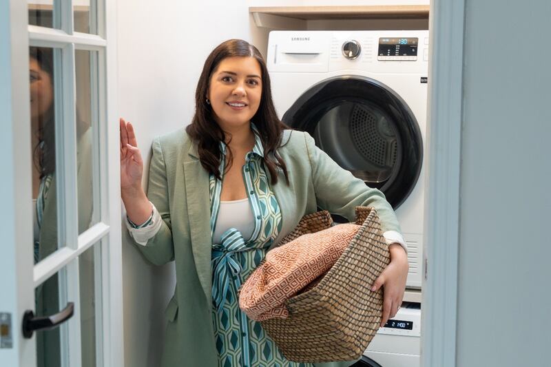 Jaimie Cantwell, head of commercial at Currys Ireland, shows how to box clever with space in her laundry room where she– stacks the tumble dryer above the washing machine