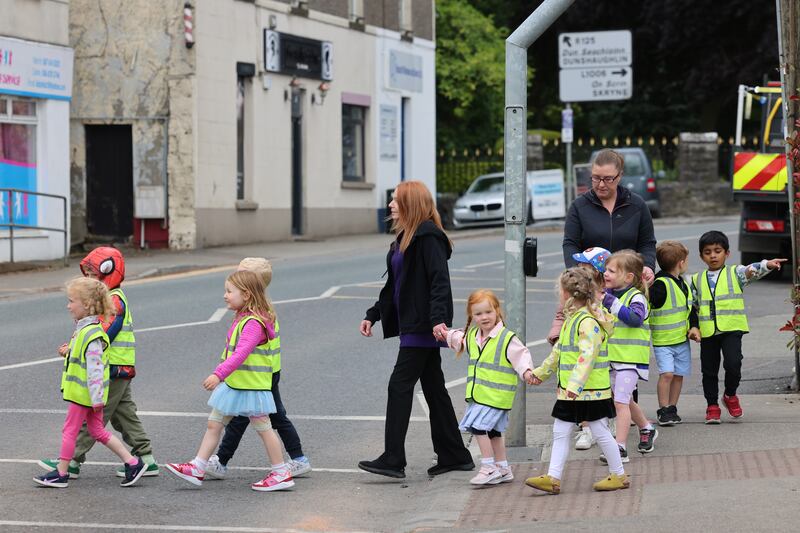 The children from Happy Days childcare on their way to visit residents at the Silver Stream Nursing Home in Ratoath. Photograph: Dara Mac Dónaill







