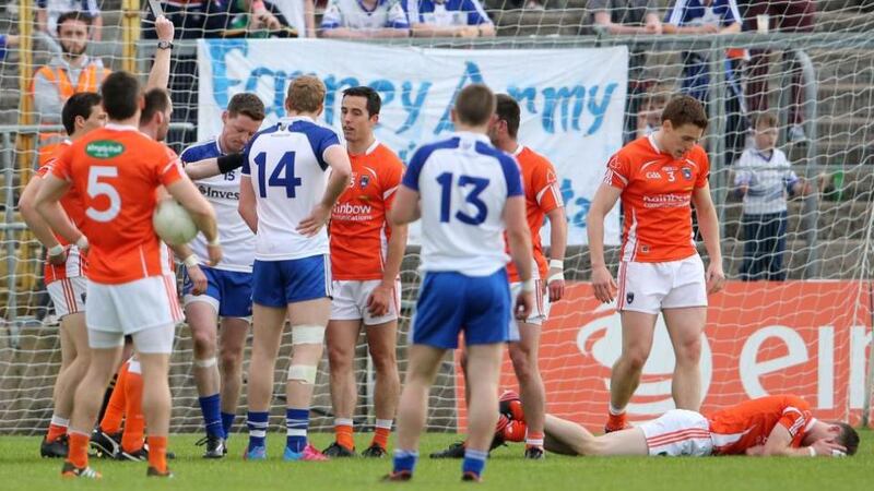 Monaghan’s Conor McManus is shown a black card by referee Joe McQuillan in St Tiernach’s Park yesterday. Photograph: Inpho/Cathal Noonan