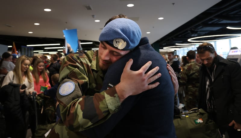  Ben MacScalai is hugged by his father Damien at Dublin Airport as 124 Irish troops from the 124th Infantry Battalion returned home following a six month deployment in Lebanon . Photo: Bryan O’Brien
