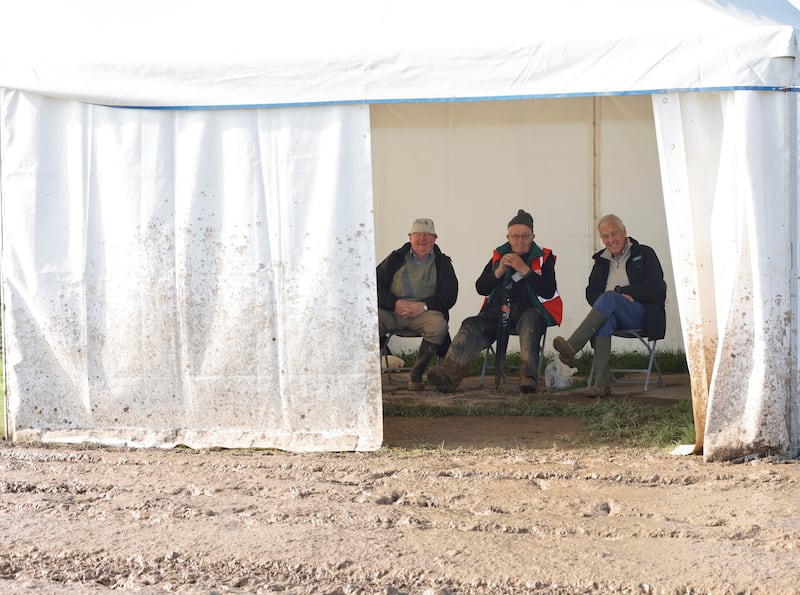 Three men watching the Senior Reversable competition from the comfort of a tent. Photograph: Alan Betson/The Irish Times