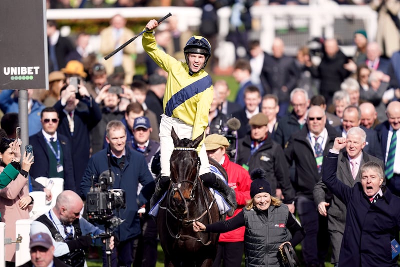 Michael O'Sullivan celebrates winning the Sky Bet Supreme Novices' Hurdle with Marine Nationale, alongside owner and trainer Barry Connell (right) at the 2023 Cheltenham Festival. Photograph: Mike Egerton/PA