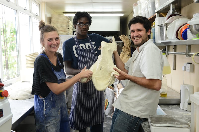 Co-Founders Max Tobias (right) and Daisy Terry with colleague Kia at The Dusty Knuckle Bakery in London. Photograph: Jeremy Selwyn/Evening Standard via Getty Images