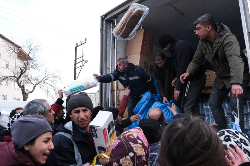 Volunteers deliver water, heaters, blankets and hygiene products to people in Elbistan Turkey, on Wednesday, following Monday's earthquake. Photograph: Mehmet Kacmaz/Getty Images