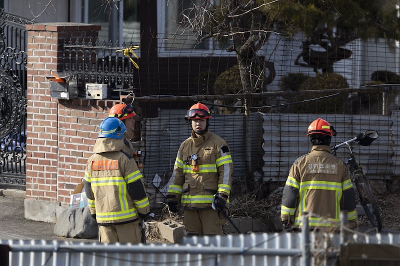 Rescue services personnel at the site of an accidental fighter jet bombing in Pocheon, South Korea. Photograph: Jeon Heon-Kyun/EPA