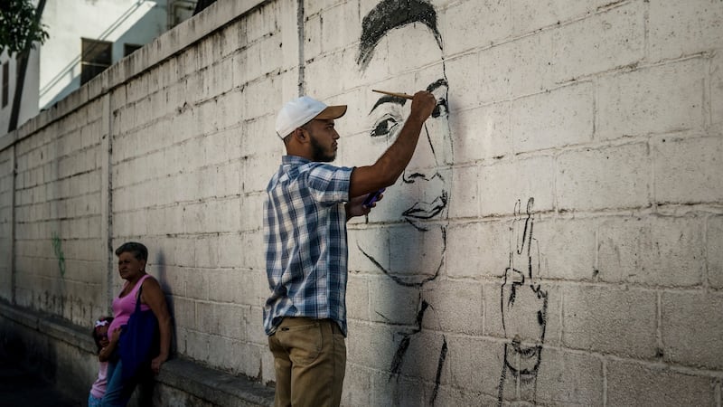 A mural paying tribute to Alixon Pisani, who was killed aged 19, in Catia, Caracas. Photograph:  Meridith Kohut/The New York Times