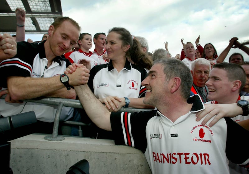 Paddy Tally celebrates with Tyrone manager Mickey Harte in September 2003. Photograph: Morgan Treacy/Inpho