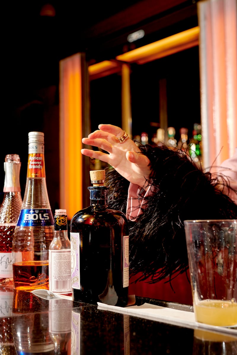 Kylie Minogue reaches for gin to add to her Pink Pearl cocktail at Bemelmans Bar. Photograph: Gabby Jones/The New York Times