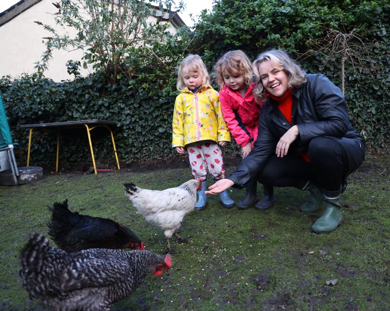 Rachel Flynn and her children, Bódhan Howlett Flynn (3) and Nell Howlett Flynn (7) and their hens at home in Dublin. Photograph: Bryan O’Brien