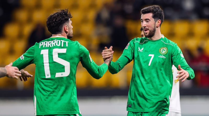 Finn Azaz celebrates scoring his goal with Troy Parrott. 