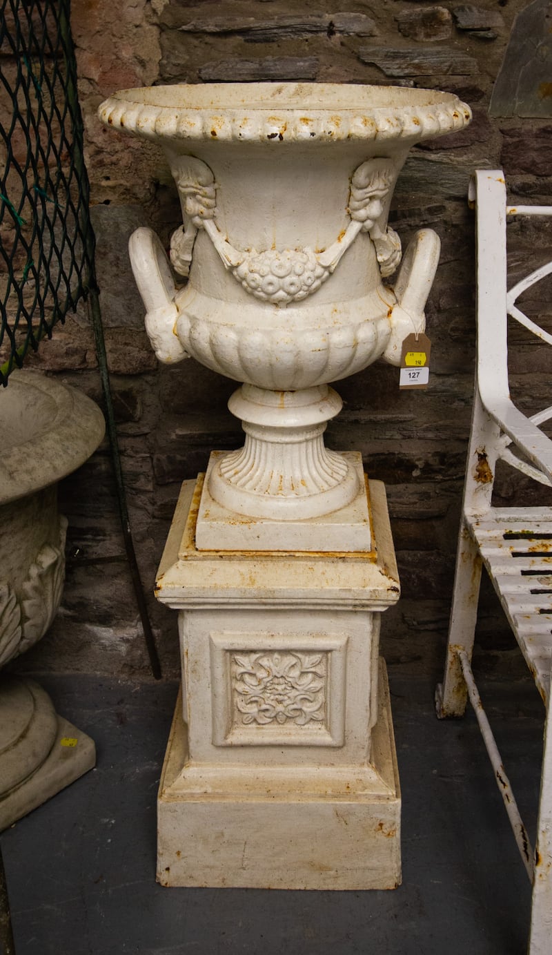 There are numerous planters from a set of tall ornate cast models that would suit the front steps of a big period pile to more affordable sets