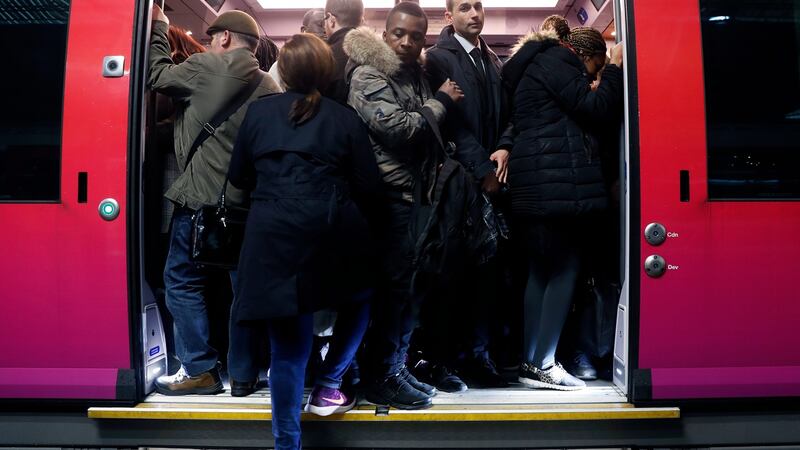 A train at the Gare Saint Lazare in Paris is packed with commuters on Tuesday, as a strike by rail workers severely hit services. Photograph: Etienne Laurent/EPA