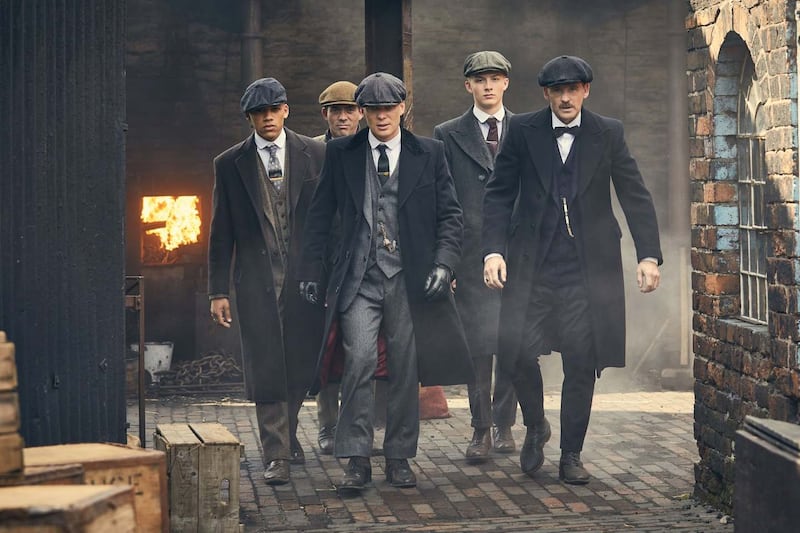 Cillian Murphy as Tommy Shelby with his gang in Peaky Blinders