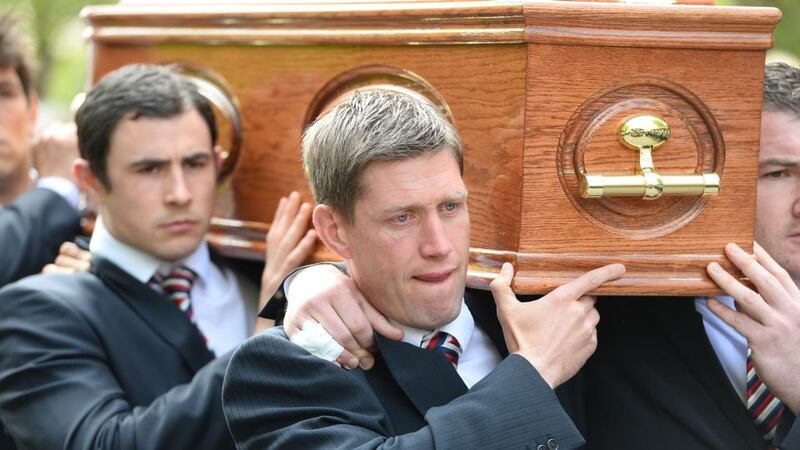 Munster’s Ronan O’Gara carrying Donal Walsh’s coffin at the church. Photograph:  Domnick Walsh/Eye Focus