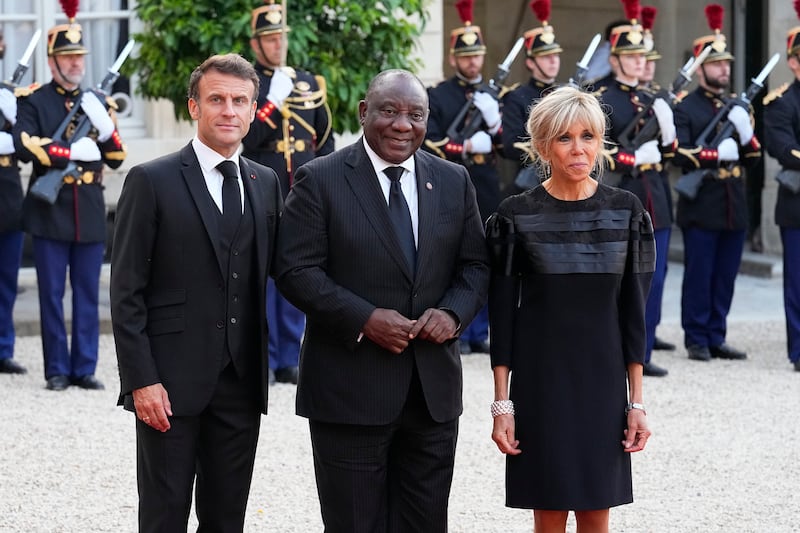 French president Emmanuel Macron and his wife Brigitte welcome Cyril Ramaphosa (centre) before dinner at the Elysee Palace in Paris earlier this month. Photograph: Michel Euler/AP