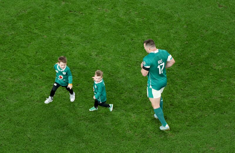 Ireland’s Cian Healy celebrates with his children Beau and Russell after the match. Photograph: Inpho